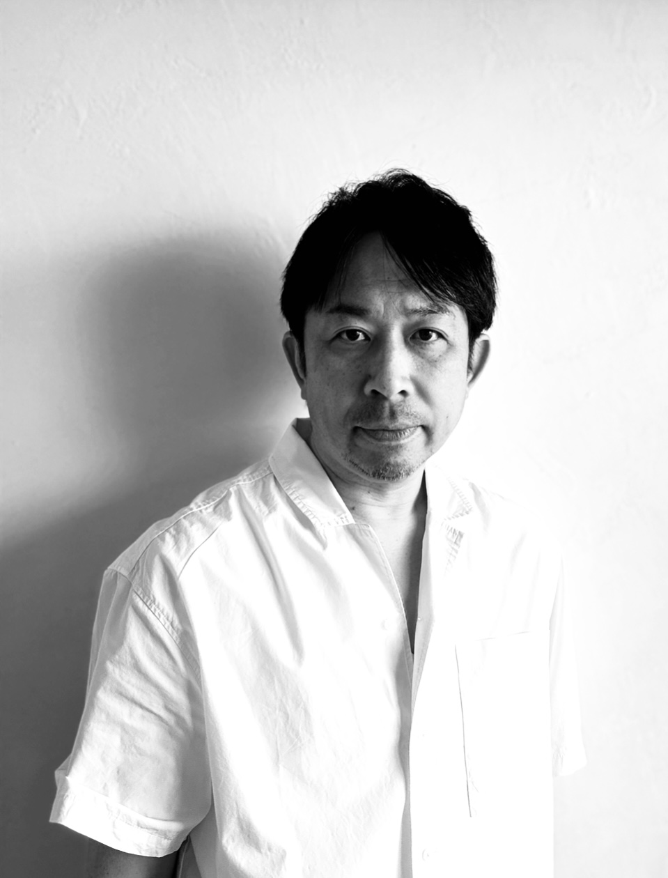 Professional portrait of Takeda Tomoyuki in white shirt
